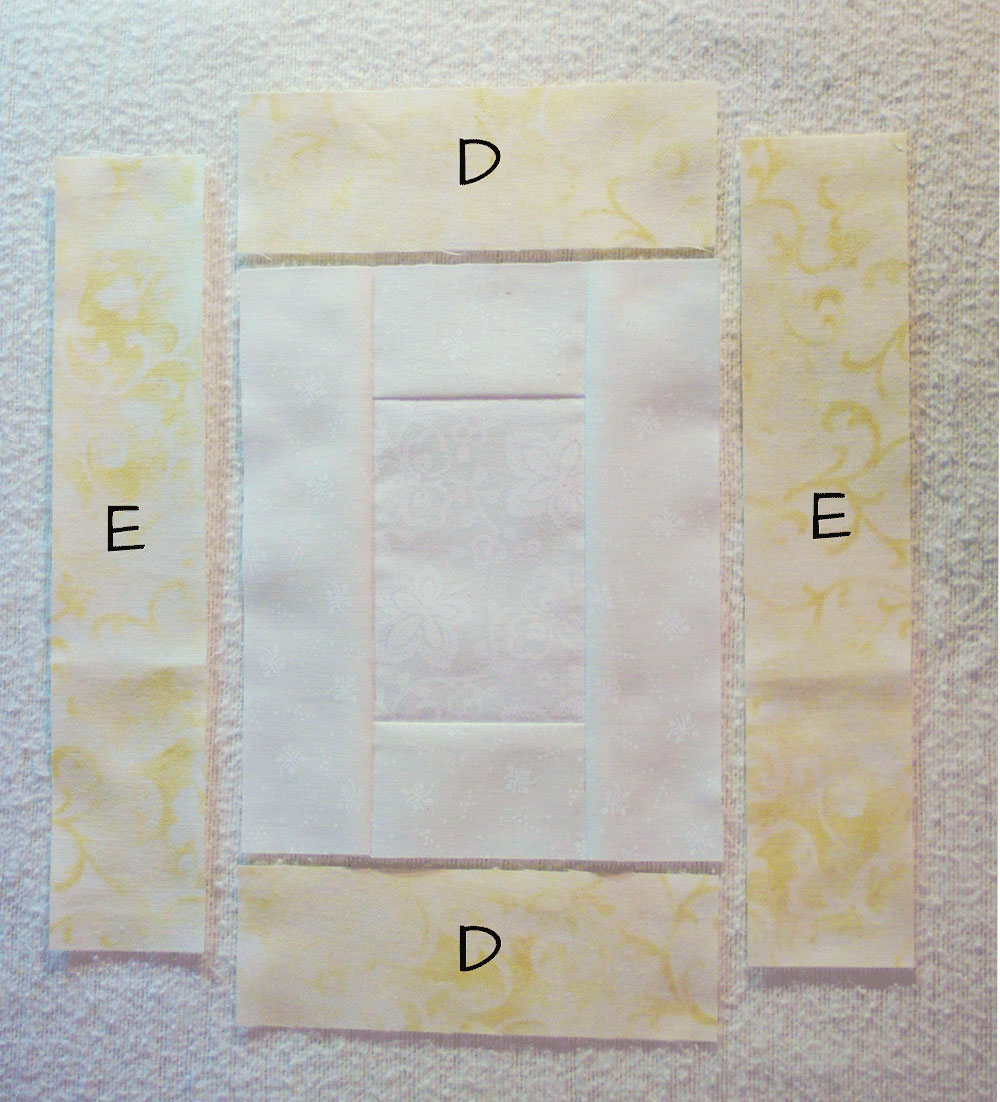 Yellow strips of fabric around a white square
