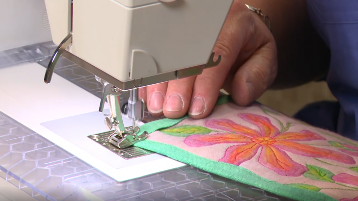 Adding a green edge to an embroidered quilted square