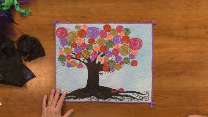Tree with colorful fabric swirls