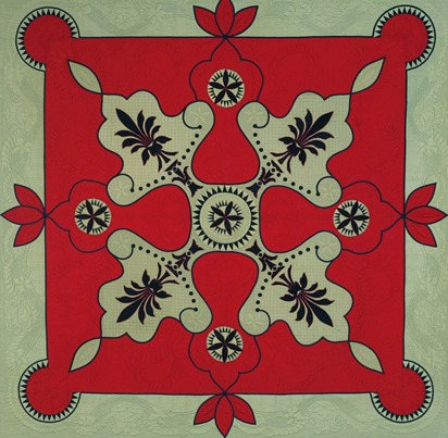 red quilt with leaf design