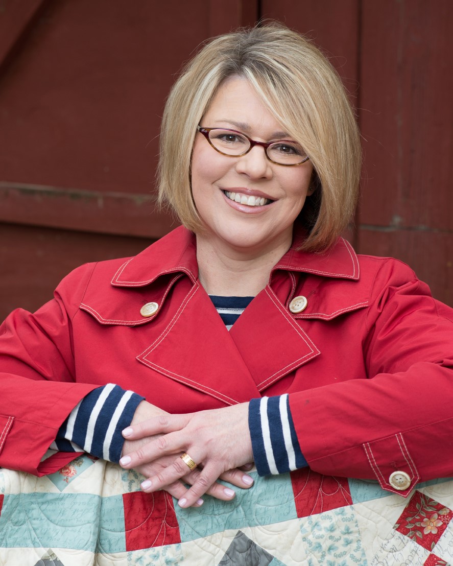 Headshot of a woman in glasses