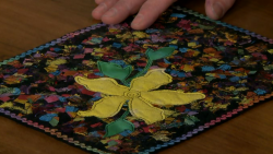 Flower applique on a fabric square