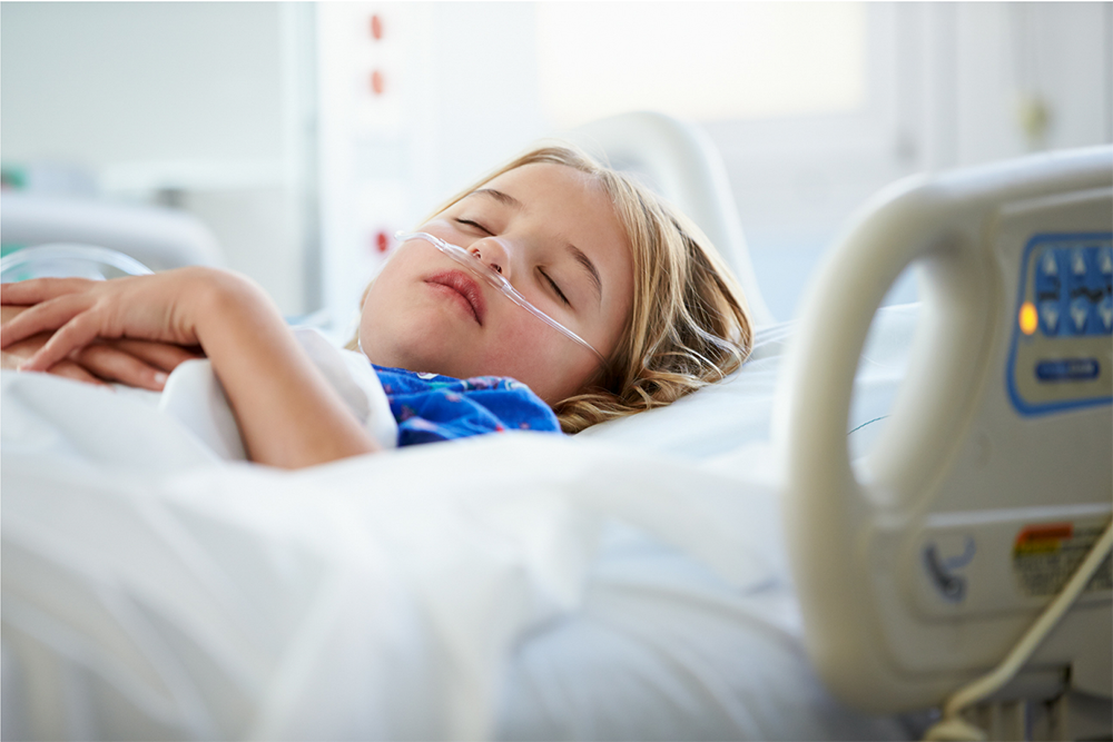 child in a hospital bed