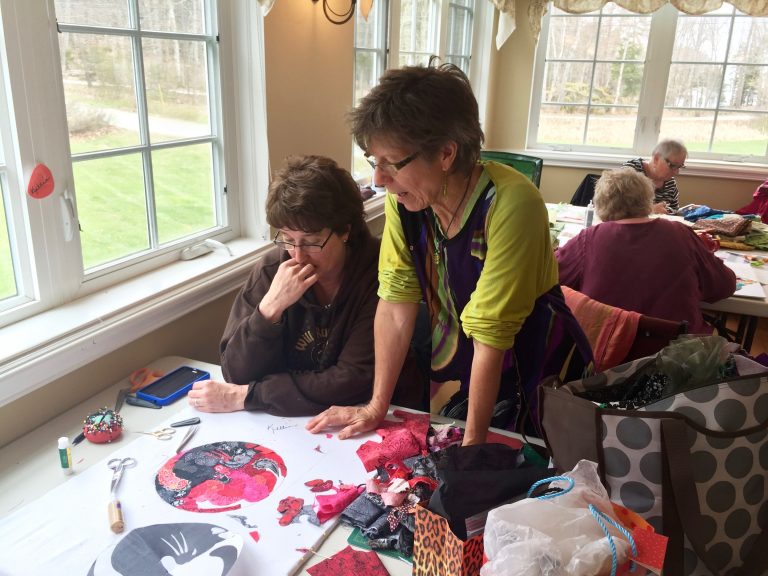 Woman helping out a quilter