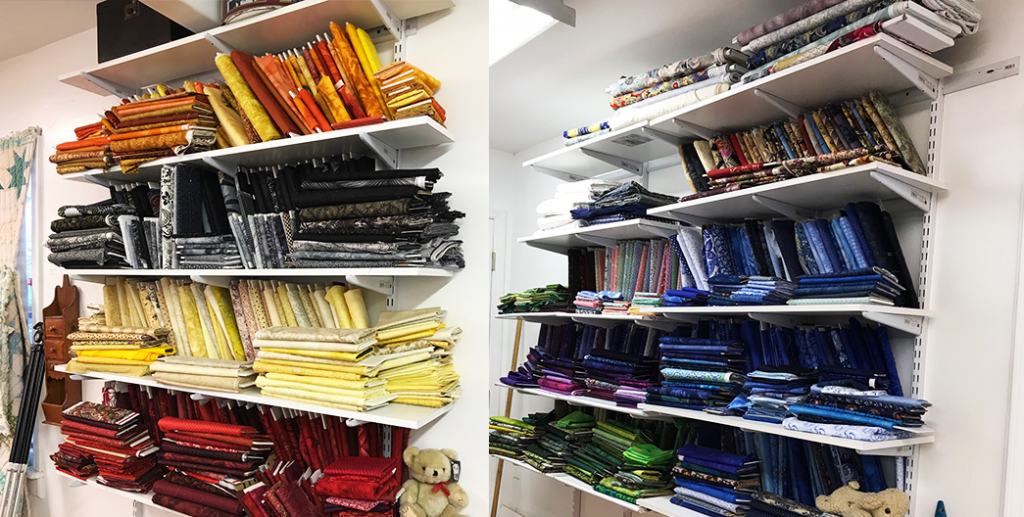 shelves of fabric organized by color