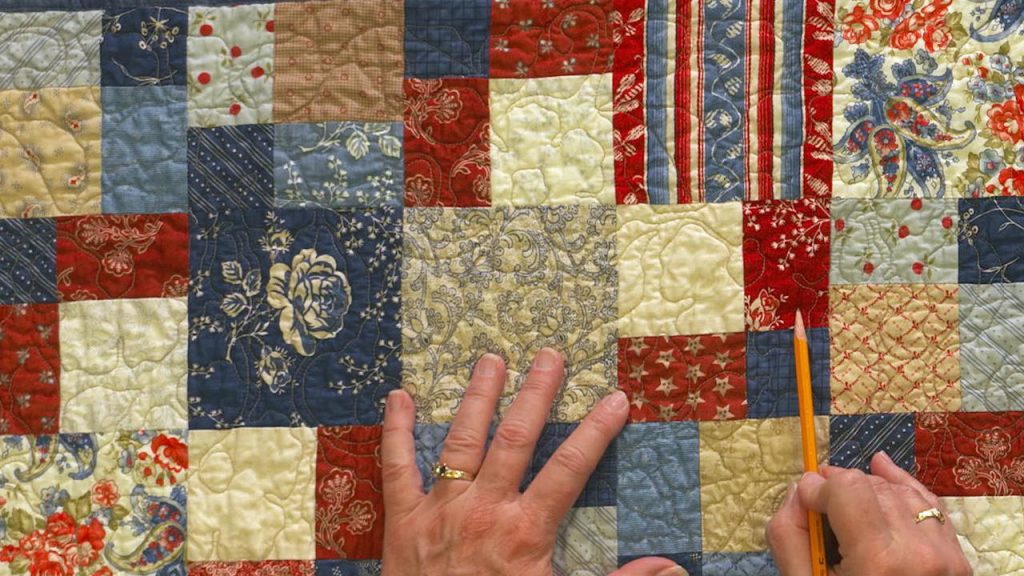 Pointing to a square in a quilt