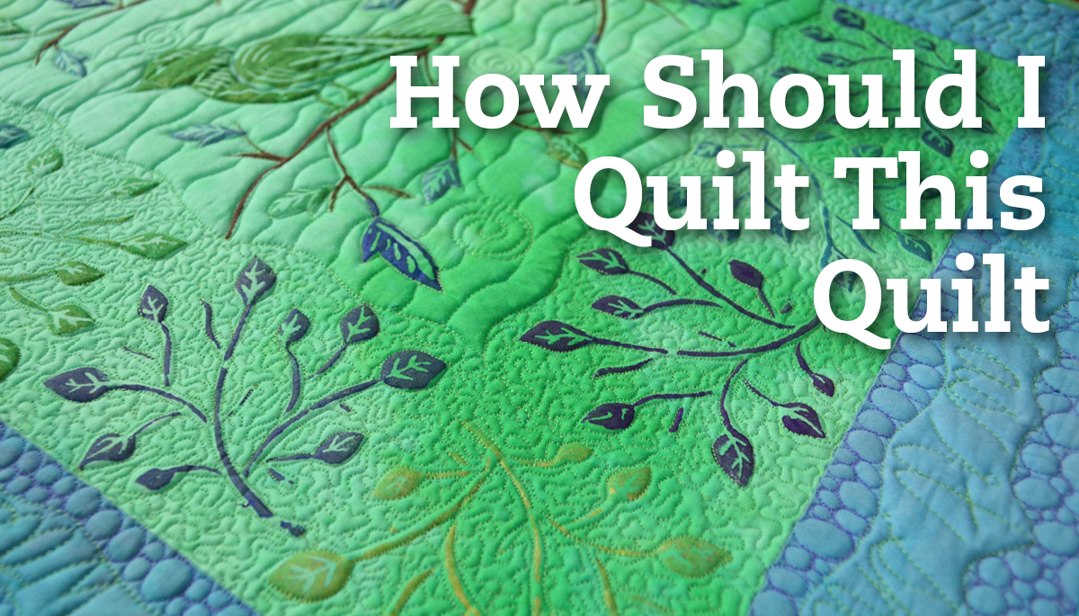Green and blue leaf pattern fabric with how should I quilt this quilt text