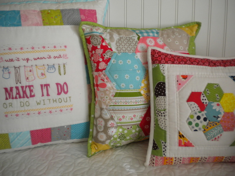 three quilted pillows