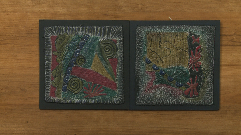 Two embroidered art pieces