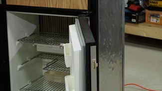 Avoid RV refrigerator repairs by not placing heavy items in the door