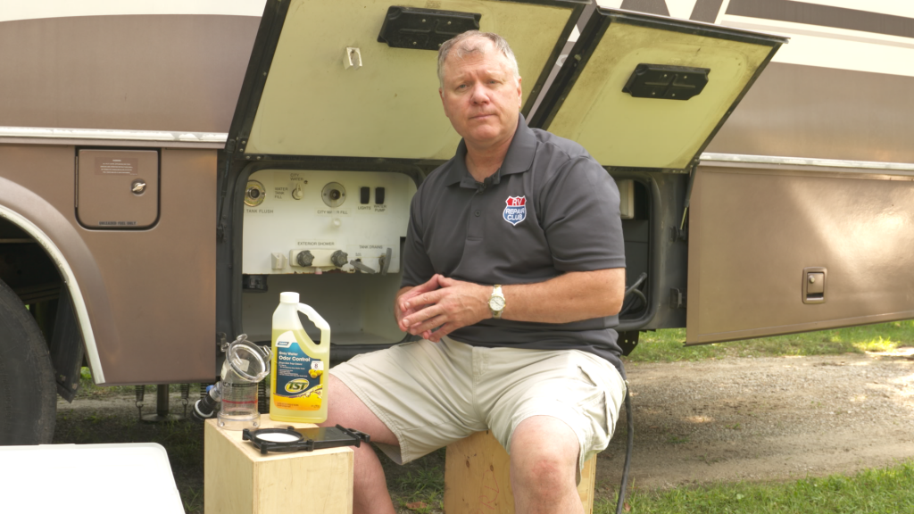 Man servicing an RV