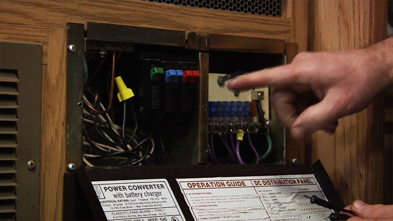 Person pointing to an electrical box