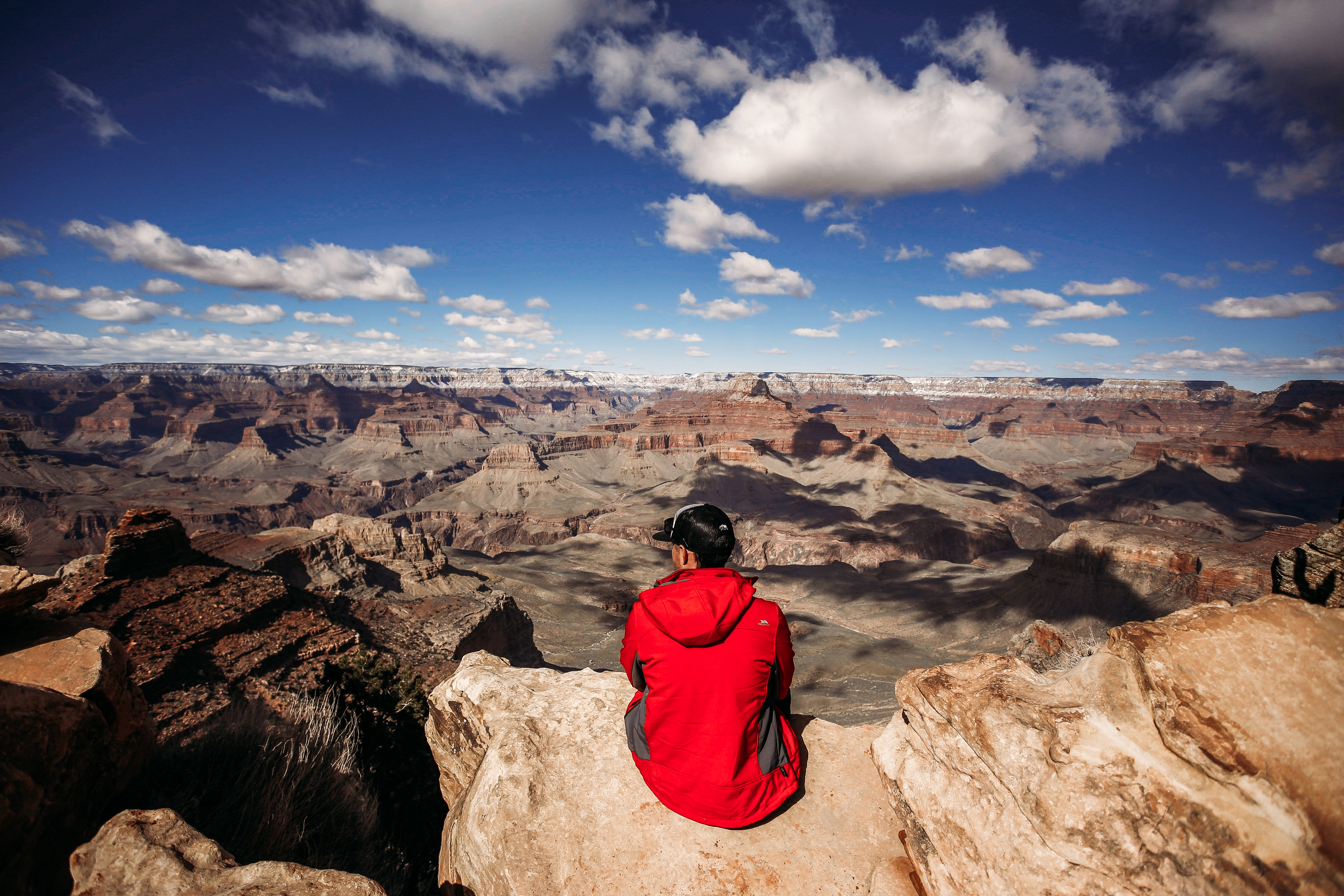 Man sitting on a canyon ledge