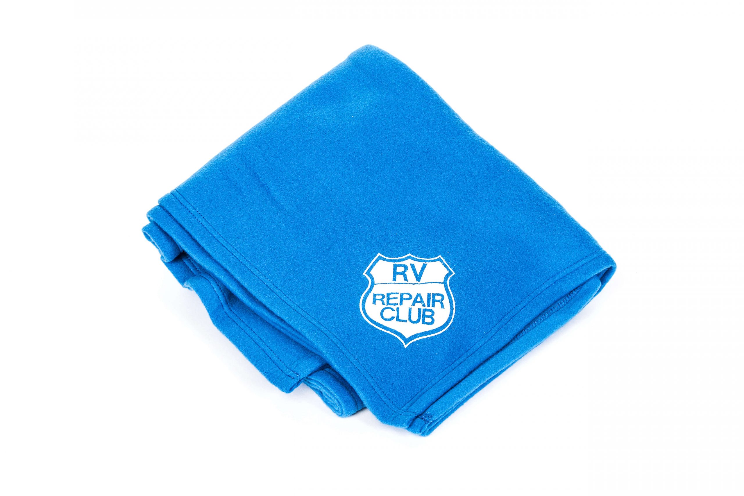 RV Repair Club Logo on a folded blue blanket