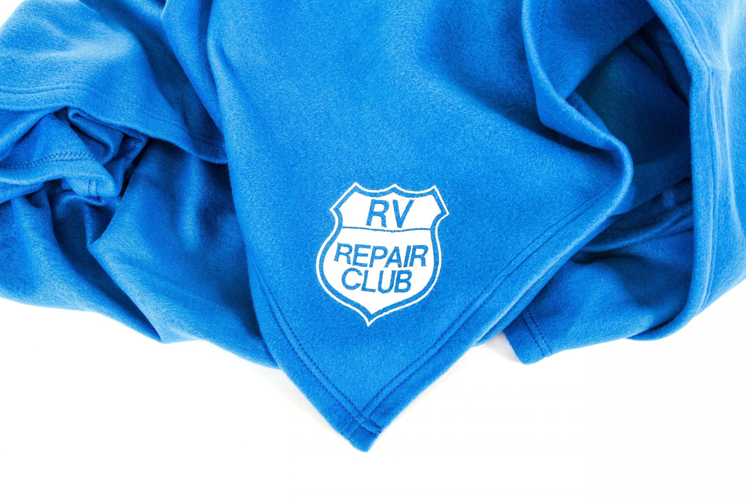RV Repair Club Logo on a blue blanket