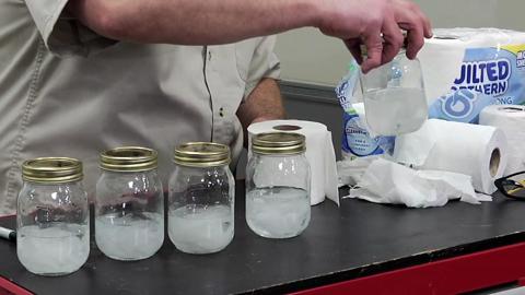 Dissolved toilet paper in water in mason jars