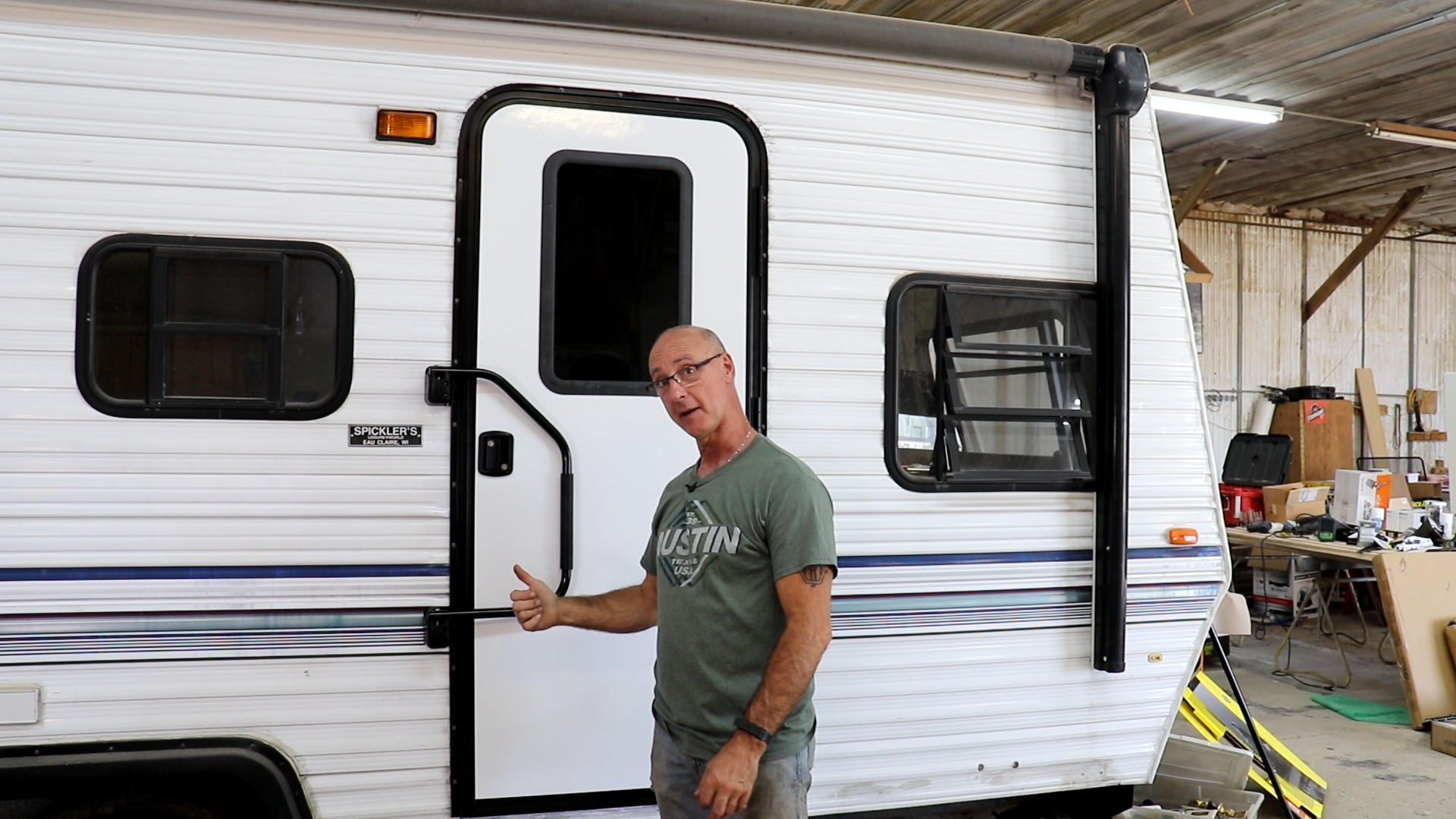 Man outside an RV door