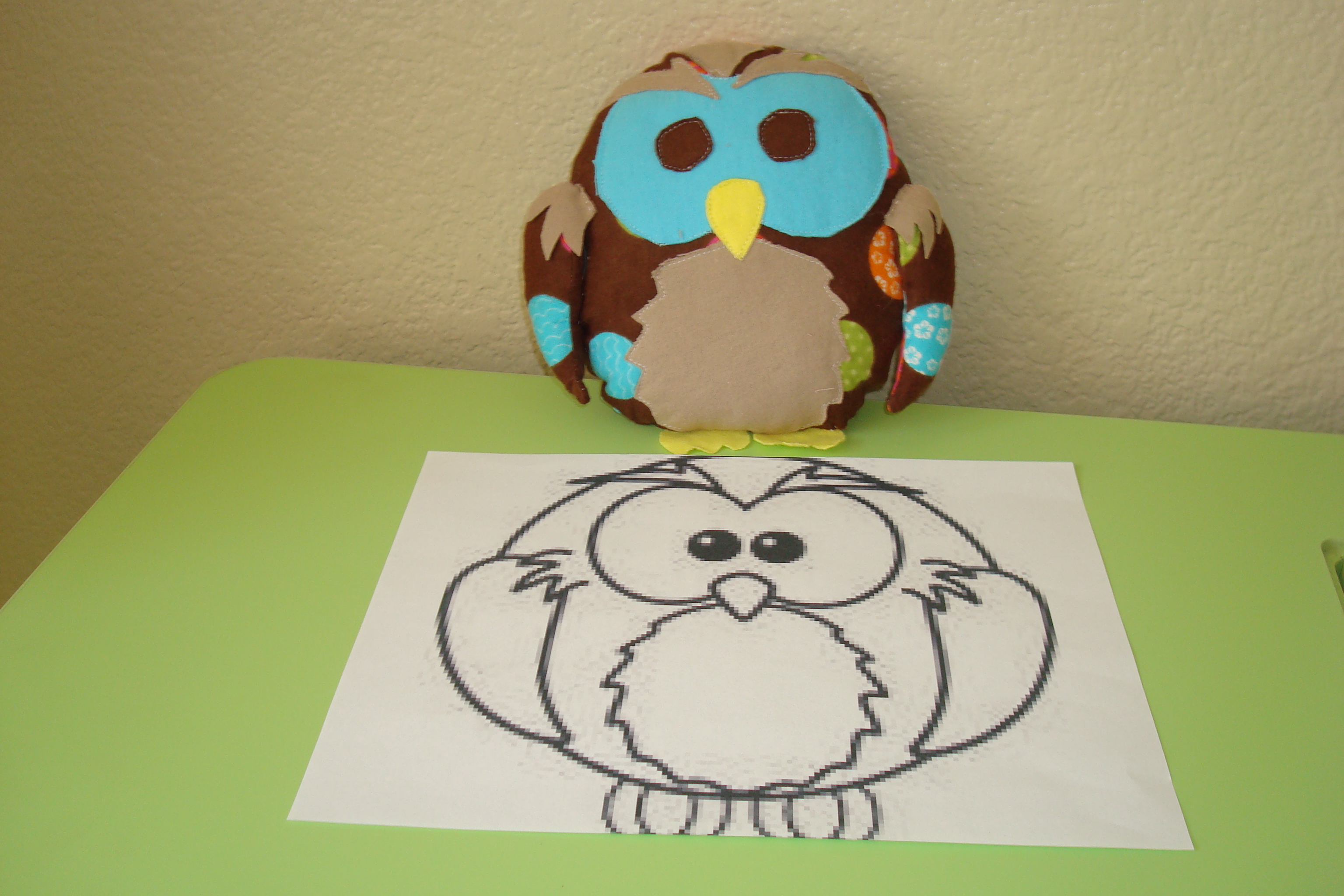 Sewn owl next to the template