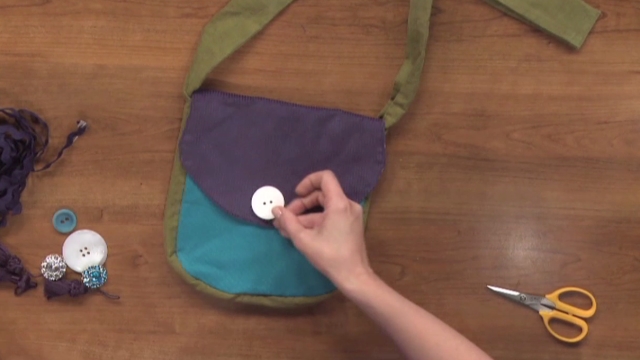 Sewing a button a crossbody purse