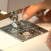 Putting thread into a sewing machine