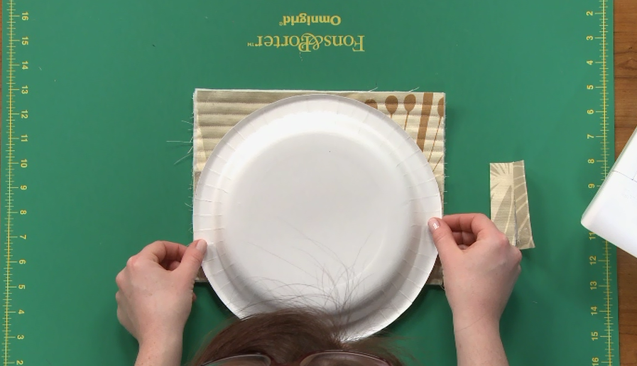 Using a paper plate to trace a circle