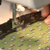 Sewing black lace on car print fabric