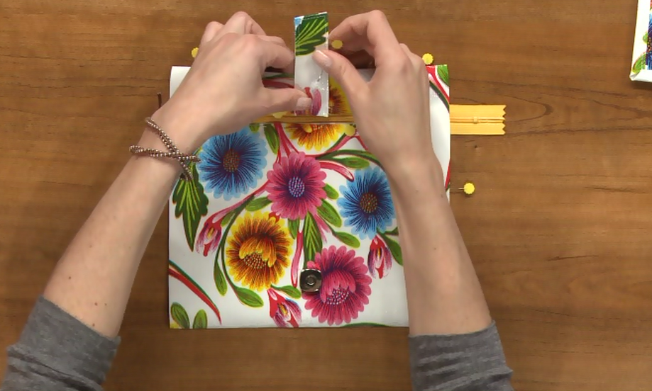 Adding a strap to a floral pattern wallet
