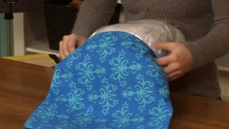 Putting a cover over a throw pillow