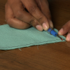 Taking out stitches in a fabric square