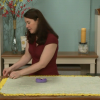 Woman working with yellow minky fabric