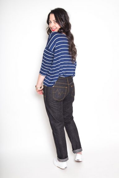 Girl in a striped shirt modeling jeans