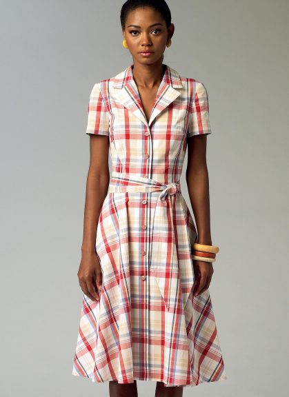 Woman with a button front shirt dress with a tie