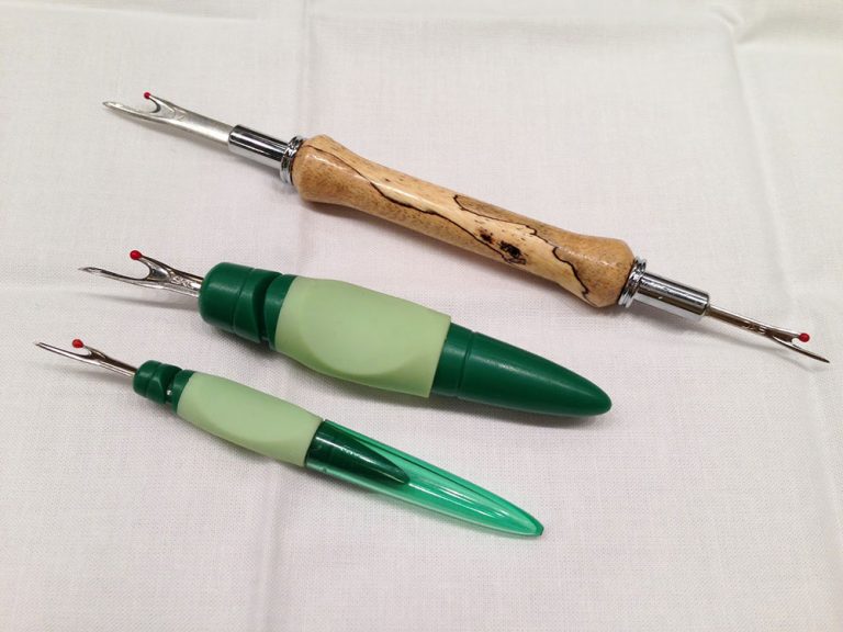 Three different seam rippers