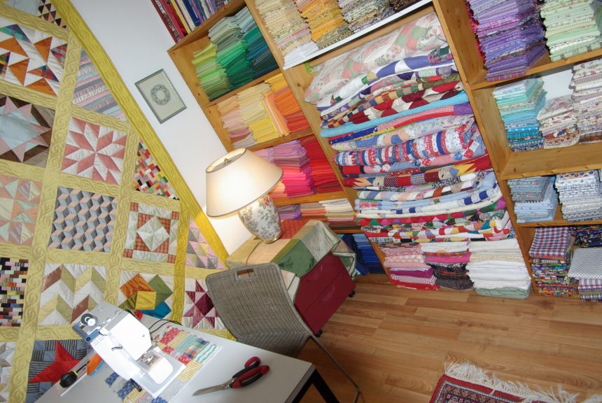 Organized sewing room shelves