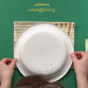 Using a paper plate to create a circle