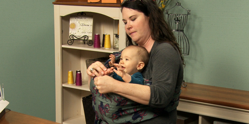 Woman with a baby in a sling