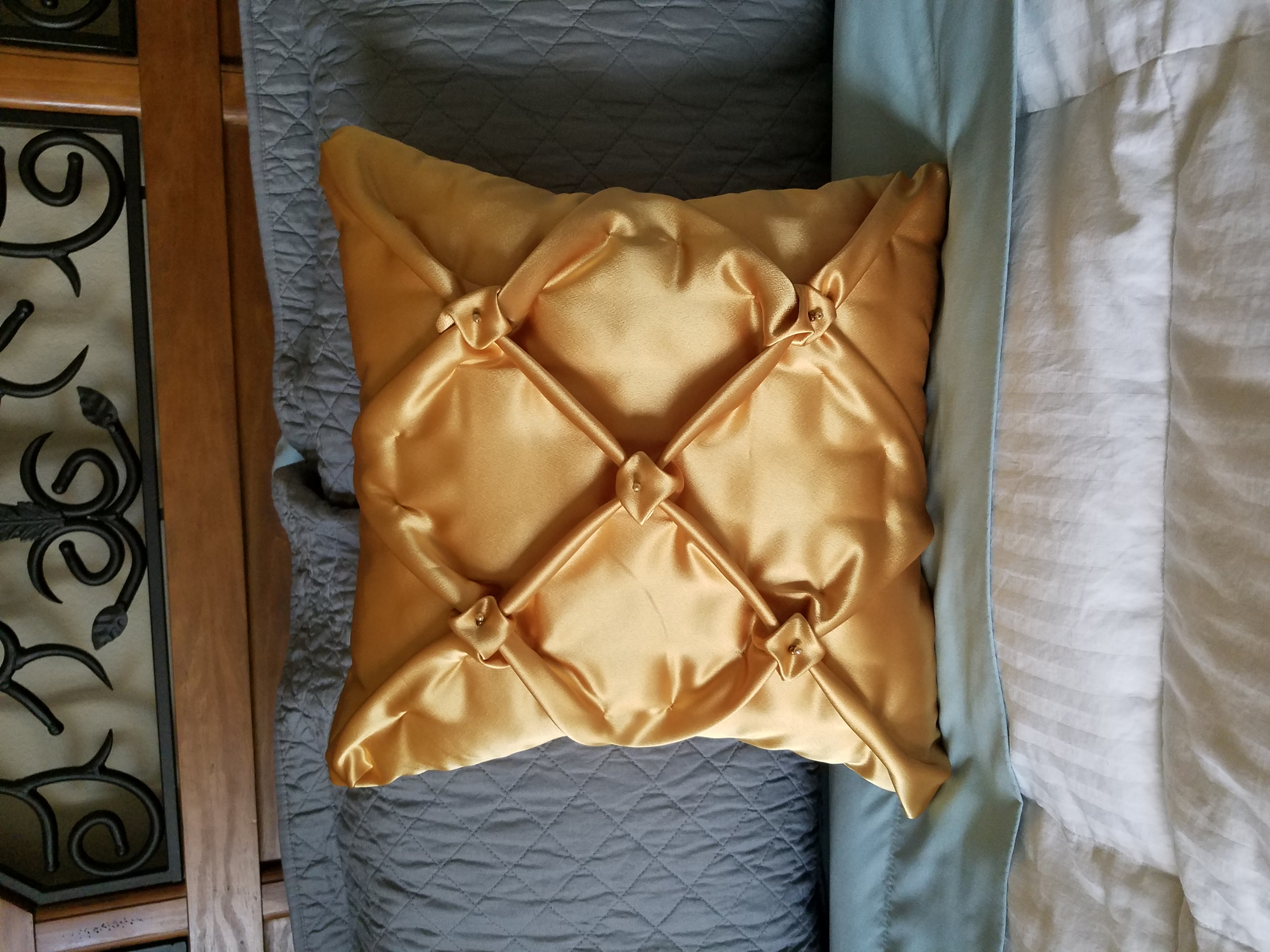 Gold smocked pillow