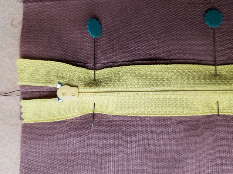 Pinned zipper in position