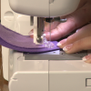 Sewing purple felt