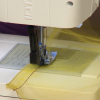Sewing yellow fabric