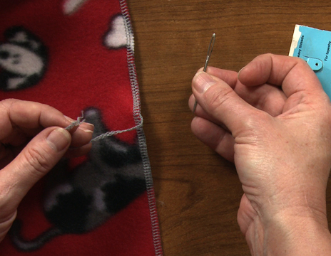 Hand sewing a seam