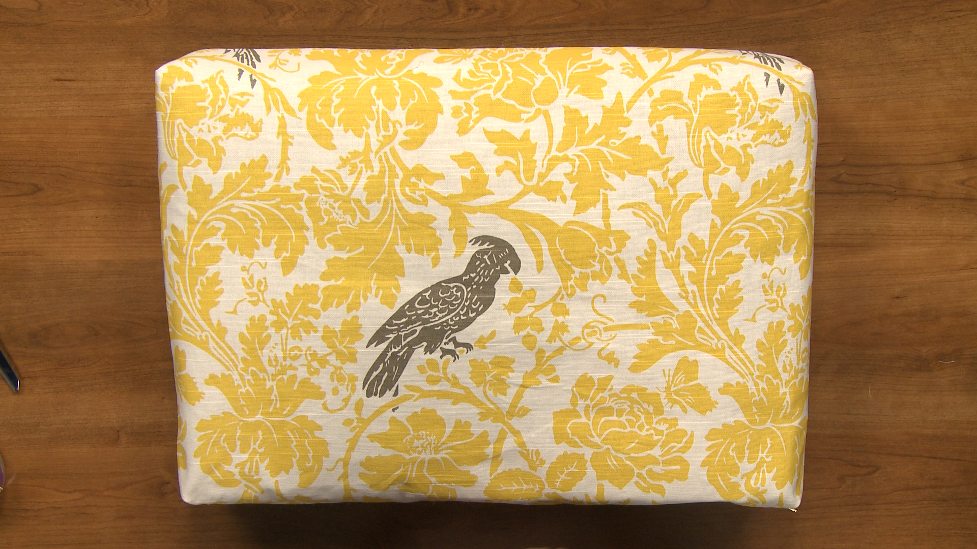 Yellow leaf pattern fabric with a black bird