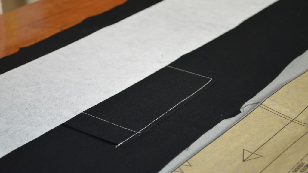 White strip of fabric on black