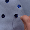 Sewing on blue sequins