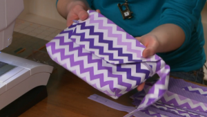 Purple chevron bag with a zipper