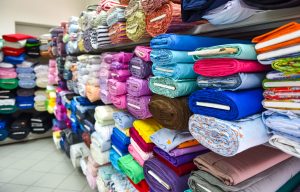 Piles of fabric in a store