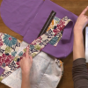 Using floral and purple fabric for a crossbody bag