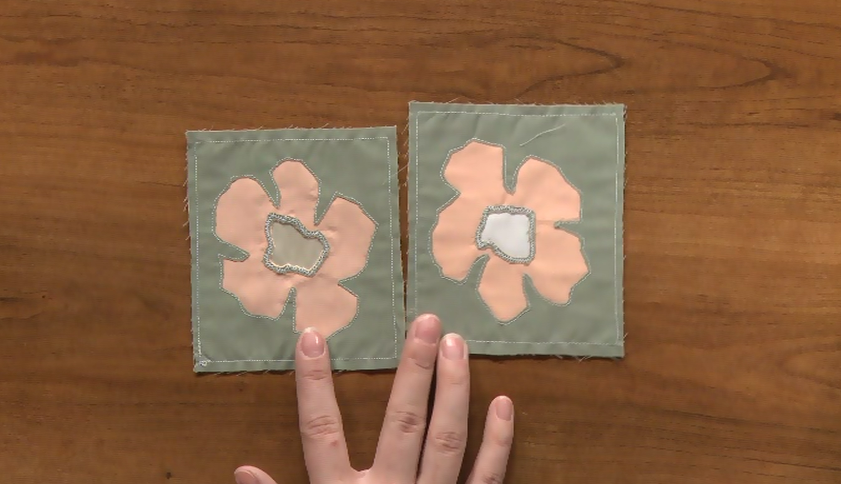 Two squares with sewn flowers