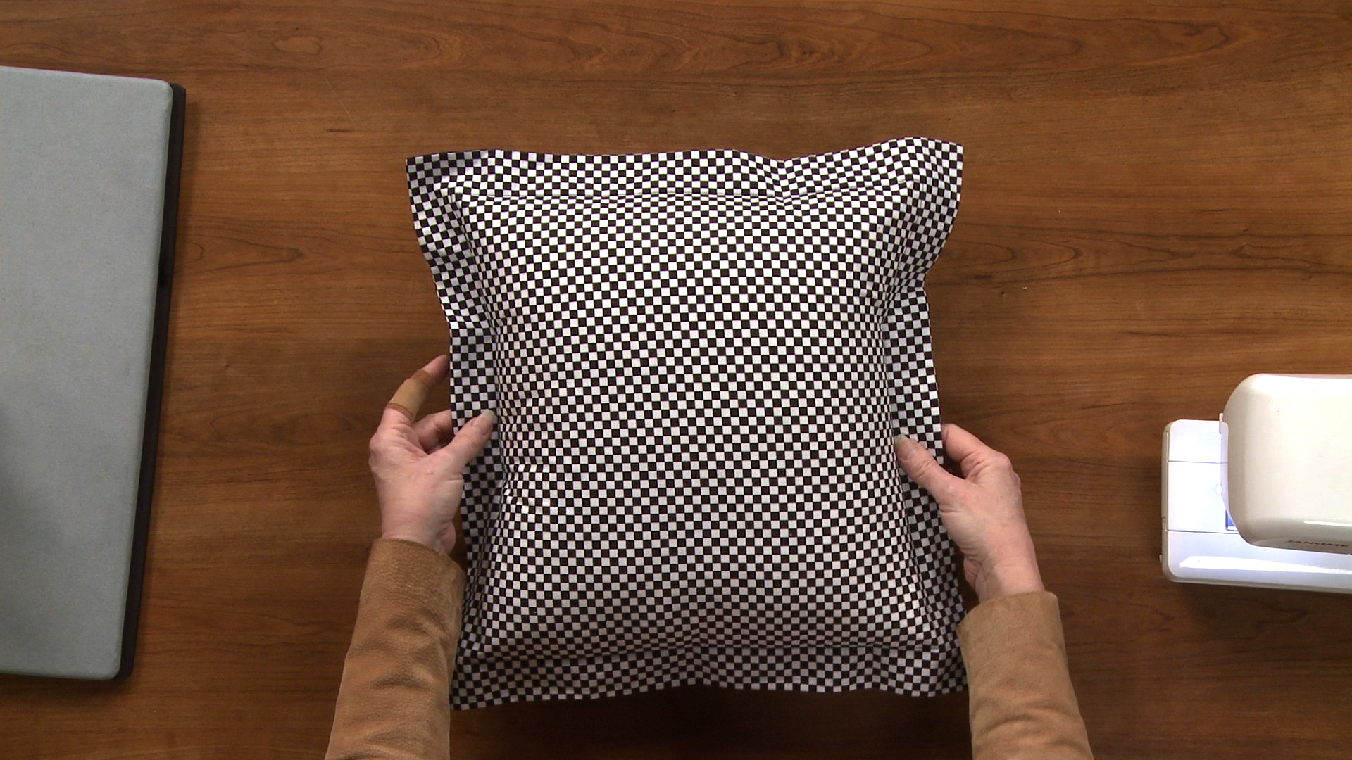 Black and white checkered fabric pillow