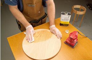 Photo 7. I wipe the top with denatured alcohol to expose any glue spots that remain after the sanding. If any appear, I sand a little more and repeat the process. Once clear of spots, the tabletop is ready for finishing.